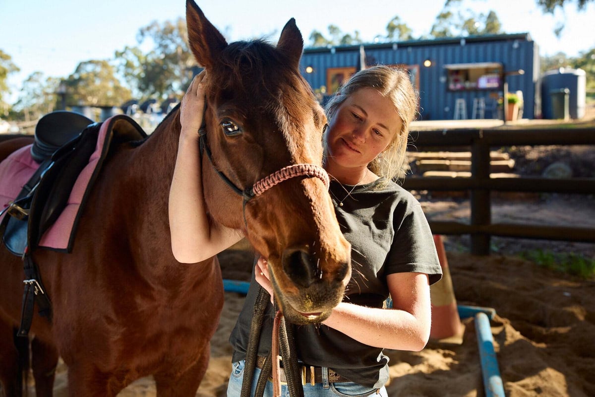 A woman with her horse.